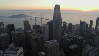 5.7K stock footage aerial video reverse view of Salesforce Tower and skyscrapers at sunrise in Downtown San Francisco, California Aerial Stock Footage | PP0002_000055