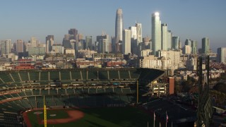 5.7K stock footage aerial video ascend from baseball stadium to focus on the skyline of Downtown San Francisco, California Aerial Stock Footage | PP0002_000083