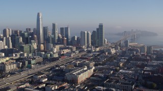 5.7K stock footage aerial video stationary view of I-80 to Bay Bridge near skyline, Downtown San Francisco, California Aerial Stock Footage | PP0002_000101