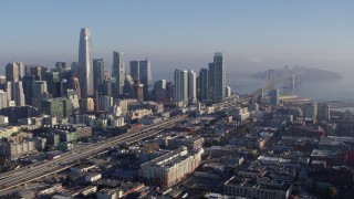 5.7K stock footage aerial video stationary view of I-80 freeway to Bay Bridge near skyline, Downtown San Francisco, California Aerial Stock Footage | PP0002_000102