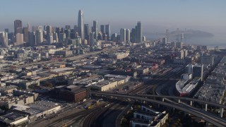 5.7K stock footage aerial video of the city skyline seen while passing train station, Downtown San Francisco, California Aerial Stock Footage | PP0002_000110