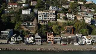 5.7K stock footage aerial video slowly flying by waterfront homes on a hill by Richardson Bay in Sausalito, California Aerial Stock Footage | PP0002_000126