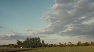 PP001_001 - HD aerial stock footage of clouds over farm fields at sunset in Joliet, Illinois