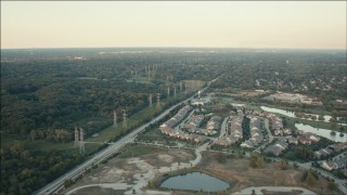 HD aerial stock footage of suburban homes and rows of power lines at sunset, Orland Park, Illinois Aerial Stock Footage | PP001_011