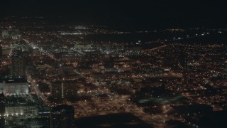 HD stock footage aerial video of flying by city apartment buildings at night in Atlantic City, New Jersey Aerial Stock Footage | PP003_026