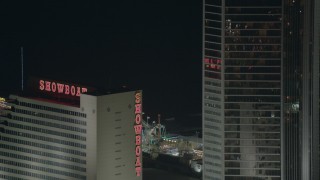 HD stock footage aerial video of Steel Pier behind a hotel and casino at night in Atlantic City, New Jersey Aerial Stock Footage | PP003_037