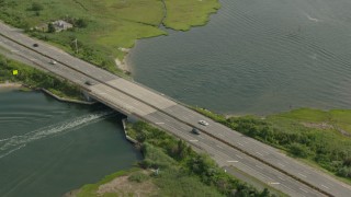 HD stock footage aerial video of a fishing boat sailing under a bridge in Seaford, New York Aerial Stock Footage | PP003_041