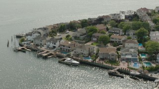 HD stock footage aerial video of upscale, waterfront homes with docks, Merrick, New York Aerial Stock Footage | PP003_042