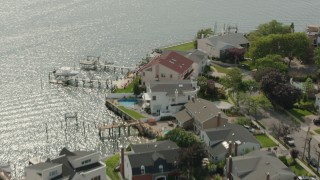 HD stock footage aerial video of flying over upscale, waterfront homes and a bay in Merrick, New York Aerial Stock Footage | PP003_043