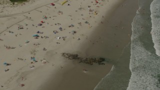 HD stock footage aerial video of a reverse view of sunbathers on the beach in Long Beach, New York Aerial Stock Footage | PP003_054