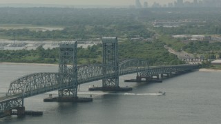 HD stock footage aerial video of tilting from a bridge to reveal the Lower Manhattan skyline, Breezy Point, New York Aerial Stock Footage | PP003_057