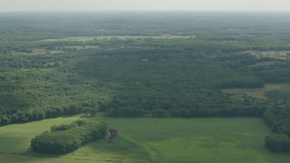 HD stock footage aerial video of approaching forest and rural neighborhoods in Jackson, New Jersey Aerial Stock Footage | PP003_061