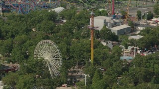 HD stock footage aerial video of a Ferris wheel and rides at Six Flags Great Adventure theme park in Jackson, New Jersey Aerial Stock Footage | PP003_070