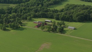 HD stock footage aerial video flyby barns and green fields at a farm in Jackson, New Jersey Aerial Stock Footage | PP003_079