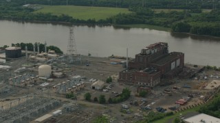 PP003_082 - HD stock footage aerial video of passing a riverfront power plant in Burlington, New Jersey