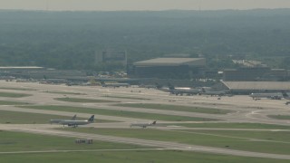 HD stock footage aerial video of commercial planes on the runways at Philadelphia International Airport, Pennsylvania Aerial Stock Footage | PP003_097