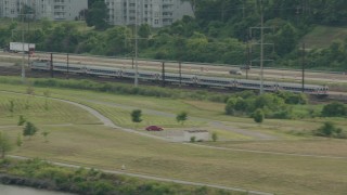 HD stock footage aerial video of a commuter train running by the river in Wilmington, Delaware Aerial Stock Footage | PP003_106