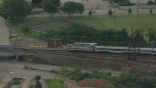 HD stock footage aerial video of tracking a commuter train cruising through Wilmington, Delaware Aerial Stock Footage | PP003_111