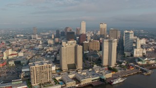 4K aerial stock footage of Downtown New Orleans seen from the Mississippi River at sunrise, Louisiana Aerial Stock Footage | PVED01_036