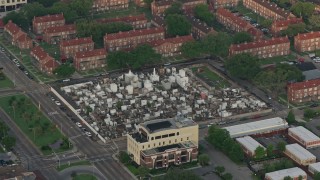 PVED01_052 - 4K aerial stock footage orbit St. Louis Cemetery at sunrise in French Quarter, New Orleans, Louisiana