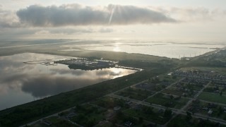 PVED01_061 - 4K aerial stock footage fly over Lower Ninth Ward Neighborhoods toward water treatment plant at sunrise in New Orleans, Louisiana