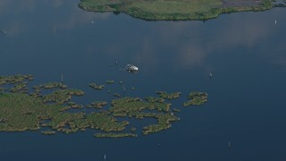 4K aerial stock footage orbit a capsized boat in the water at sunrise in St. Bernard Parish, Louisiana Aerial Stock Footage | PVED01_066E