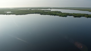 4K aerial stock footage tilt to reveal marshland and bayou at sunrise in St. Bernard Parish, Louisiana Aerial Stock Footage | PVED01_070