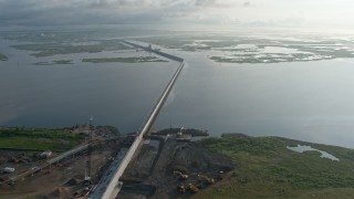 PVED01_077E - 4K aerial stock footage surge barrier and gate in a St. Bernard Parish Bayou at sunrise, Louisiana