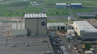 4K aerial stock footage orbit NASA Logo on factory building at sunrise in New Orleans East, Louisiana Aerial Stock Footage | PVED01_081