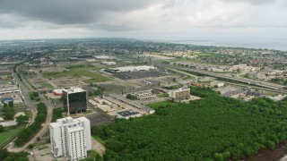 4K aerial stock footage flyby office buildings and orbit a Lowe's Store in New Orleans East at sunrise, Louisiana Aerial Stock Footage | PVED01_087