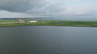 PVED01_091 - 4K aerial stock footage approach New Orleans Lakefront Airport at sunrise in Louisiana