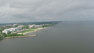 4K aerial stock footage orbit apartment buildings and suburbs by canal near shore of Lake Pontchartrain in Gentilly, Louisiana Aerial Stock Footage | PVED01_092E