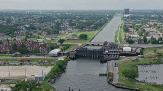 4K aerial stock footage approach and fly over 17th Street Canal pumping station in Metairie, New Orleans, Louisiana Aerial Stock Footage | PVED01_100