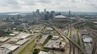 PVED01_110 - 4K aerial stock footage tilt from Interstate 10 in Mid-City to reveal Downtown skyline of New Orleans, Louisiana