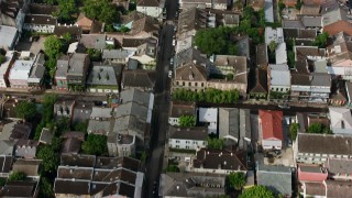 PVED01_119 - 4K aerial stock footage bird's eye of French Quarter street, tilt to reveal Downtown New Orleans skyscrapers, Louisiana