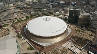 PVED01_121E - 4K aerial stock footage orbiting the Louisiana Superdome in Downtown New Orleans, Louisiana