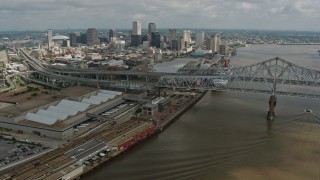 4K aerial stock footage wide orbit of the Crescent City Connection and Downtown New Orleans, Louisiana Aerial Stock Footage | PVED01_133E