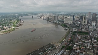 4K aerial stock footage orbit the Mississippi River and Downtown New Orleans, seen from the French Quarter, Louisiana Aerial Stock Footage | PVED01_142