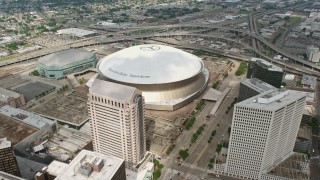 4K aerial stock footage approach and fly over Superdome and freeway interchange in Downtown New Orleans, Louisiana Aerial Stock Footage | PVED01_145