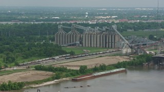 4K aerial stock footage factory silos on the shore of the Mississippi River in New Orleans, Louisiana Aerial Stock Footage | PVED01_151