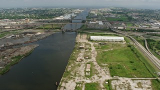 4K aerial stock footage approach small bridges and factory in New Orleans East, Louisiana Aerial Stock Footage | PVED01_167