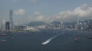 SS01_0009 - 5K stock footage aerial video approach skyscrapers and waterfront buildings in Kowloon and Hong Kong Island, China