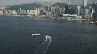 5K stock footage aerial video of Hong Kong Island shoreline seen from Victoria Harbor in Hong Kong, China Aerial Stock Footage | SS01_0015