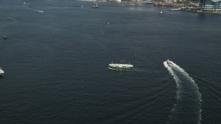 5K stock footage aerial video approach and tilt to two ferries sailing Victoria Harbor in Hong Kong, China Aerial Stock Footage | SS01_0016