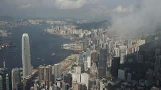 SS01_0042 - 5K stock footage aerial video approach skyscrapers, convention center and harbor on Hong Kong Island, China