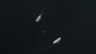 SS01_0045 - 5K stock footage aerial video bird's eye view of two ferries sailing in Victoria Harbor in Hong Kong, China