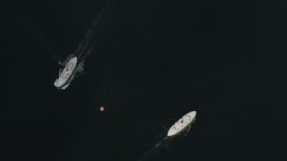 SS01_0046 - 5K stock footage aerial video a bird's eye view of ferries sailing in opposite directions in Victoria Harbor in Hong Kong, China