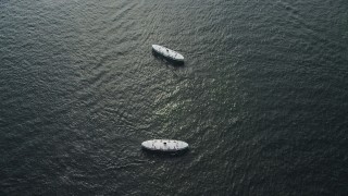 5K stock footage aerial video reverse view of two ferries sailing on Victoria Harbor in Hong Kong, China Aerial Stock Footage | SS01_0048