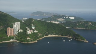 5K stock footage aerial video approach Hong Kong Island apartment buildings and pan to reveal waterfront condos, China Aerial Stock Footage | SS01_0055