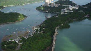 5K stock footage aerial video fly over reservoir and tilt to reveal apartment buildings overlooking harbor on Hong Kong Island, China Aerial Stock Footage | SS01_0059